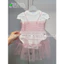 Bộ bodysuit cộc màu trắng kèm váy xòe màu hồng