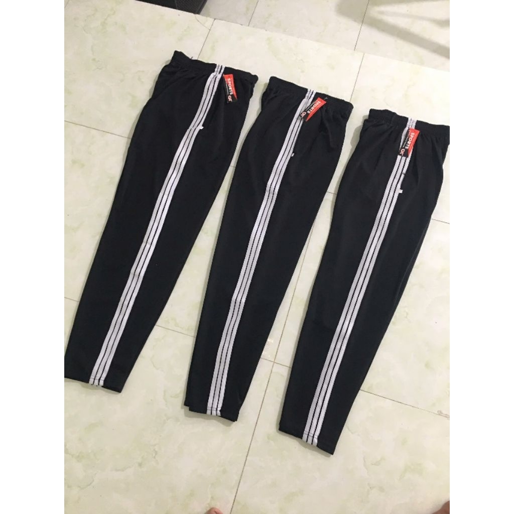 Quần thể dục thể thao nam nữ thun poly co giãn tốt, mẫu màu đen 3 sọc trắng .túi sâu có khoá kéo túi.(nts dài 3s trắng)