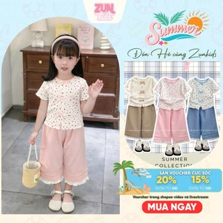 Bộ Đồ Bé Gái DORI Áo Thun Hoa Đính Nơ Quần Lửng Viền Ren – Bộ Bé Gái Dễ Thương Size 2–10 Tuổi