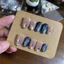 484. nailbox mắt mèo màu da, màu xanh đen bling bling