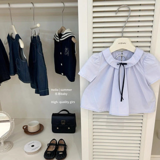 Set áo babydoll phối nơ kèm chân váy xếp ly cho bé gái
