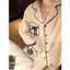 Bộ pyjama kẻ nơ túi