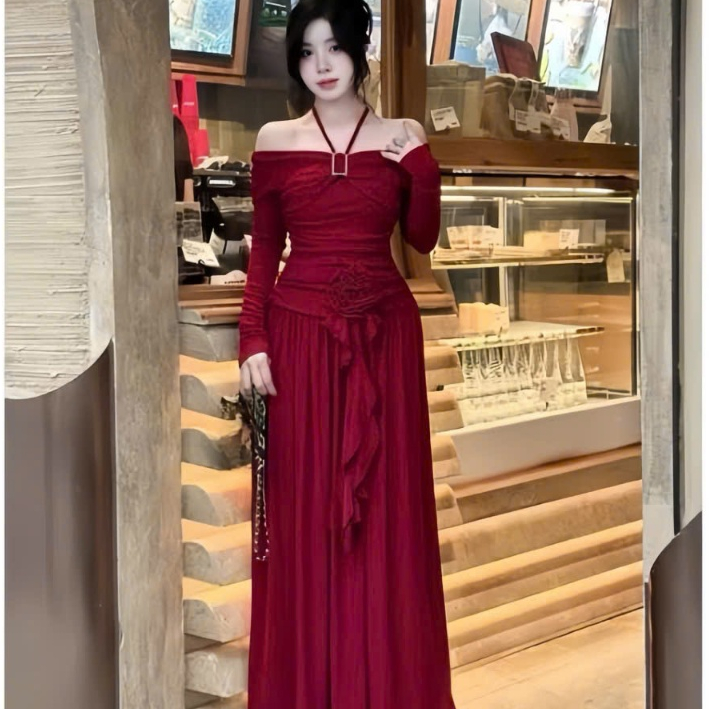 Đầm trễ vai tay dài có dây yếm kết khoen,nhúng hông đính hoa tua rua dáng dài rộng