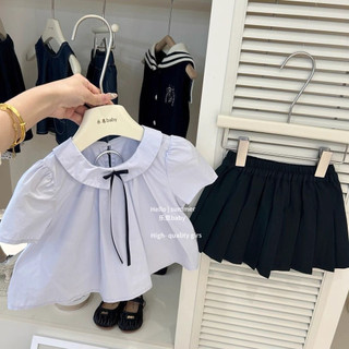 Set áo babydoll phối nơ kèm chân váy xếp ly cho bé gái
