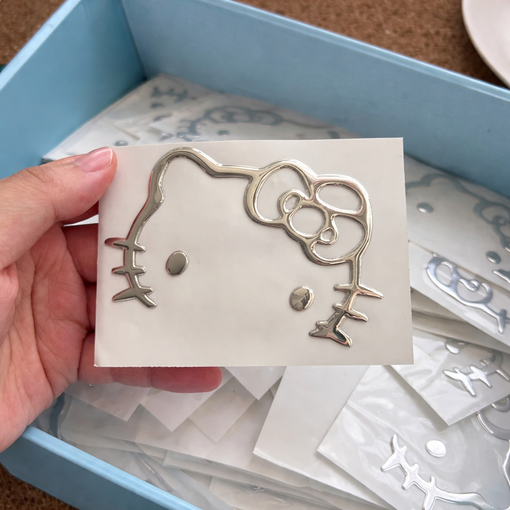 Nhãn dán Hello Kitty 3D Cao cấp Mạ Nhũ Bạc cho máy tính, tai nghe, xe điện, ô tô kích thước 9x7cm