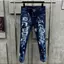 quần Jeans nam đen bạc vảy sơn đá bốn cúc có tang hồng