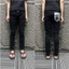 quần Jeans nam đen trơn thêu đùi vàng có bốn cúc