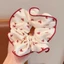 Scrunchies cột tóc nâu họa tiết chấm bi hot trend dành cho bạn nữ