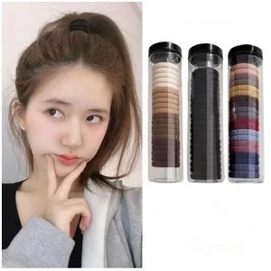 T33_Hộp 20 chun buộc tóc nhiều màu, kèm ống đựng trong suốt