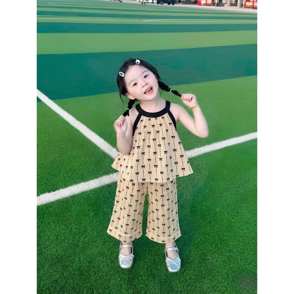Bộ bé gái cổ yếm babydoll chất lụa phối quần in nơ xinh xắn dễ thương hè 2026 H89