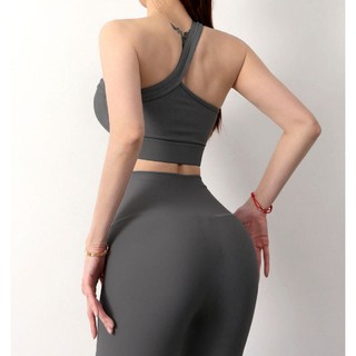 Áo thể thao nữ không tay, có lót ngực, kiểu dáng chéo vai một bên, vải có gân co giãn, 90% Nylon 10% Spandex BRC-TRINITY