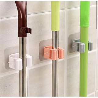 Móc dán tường giữ cây lau nhà / treo chổi chịu lực tốt không thấm nước .