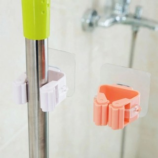 Móc dán tường giữ cây lau nhà / treo chổi chịu lực tốt không thấm nước .