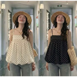 Áo 2 dây chấm bi nữ dễ phối đồ với quần và chân váy phụ hợp đi biển du lịch