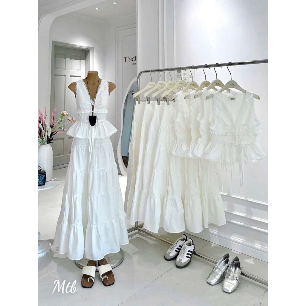 Set áo kiểu sát nách thắt nơ ngực phối chân váy dài xẻ tà màu trắng Set đồ nữ dễ thương mặc đi biển đi chơi