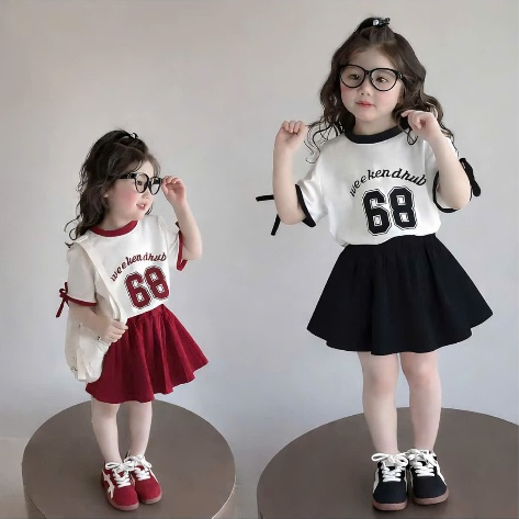 Bộ Áo Váy Bé Gái Weekend Club 68 - Set Đồ Trẻ Em Hàn Quốc Trendy Phối Nơ Siêu Dễ Thương 2 Màu Đen/Đỏ