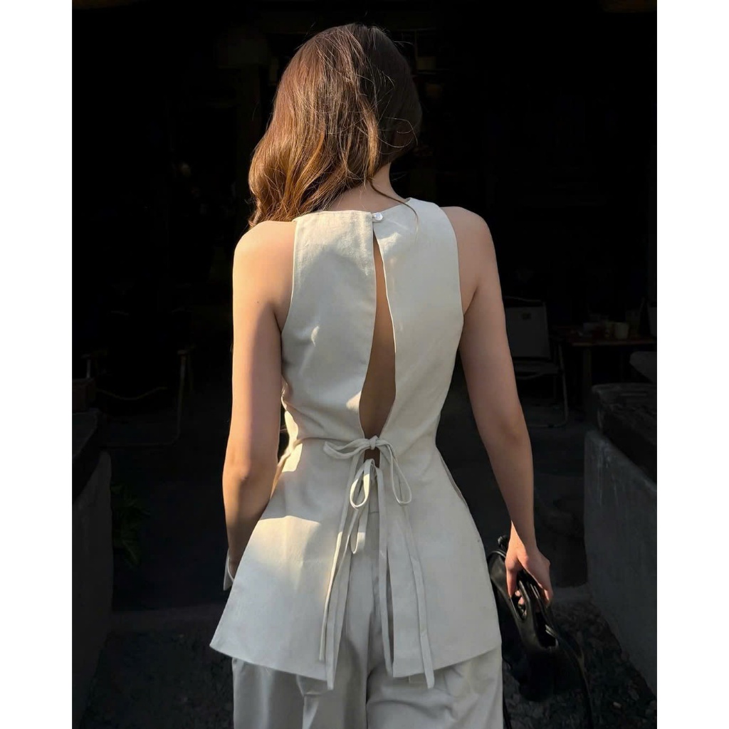 NH CLOTHER -Set đồ màu kem áo sát nách xẻ tà hở lưng thắt nơ phối quần ống suông dài