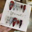 498. nailbox mắt mèo đỏ, charm đính ngẫu nhiên