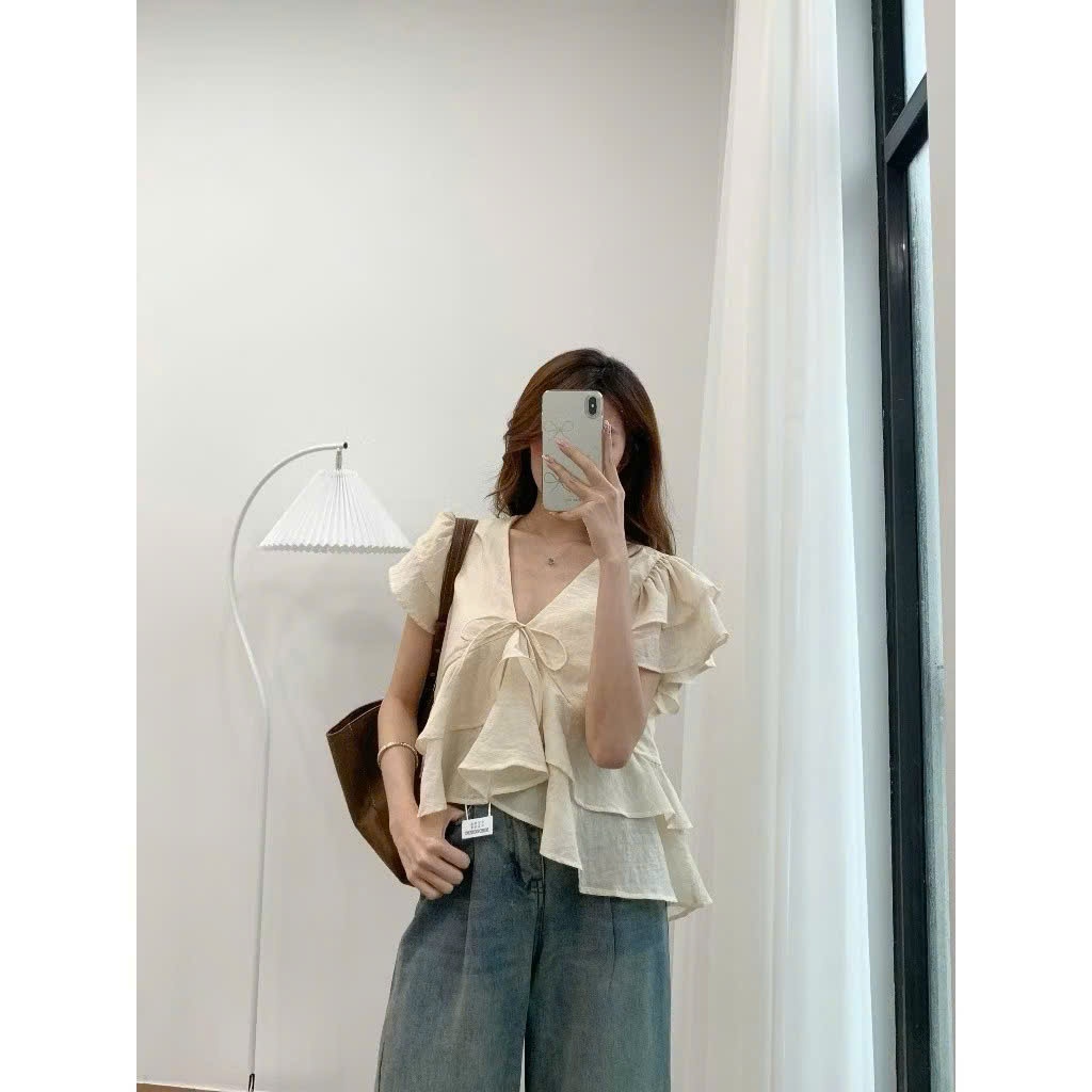 Áo kiểu nữ đũi tơ nhún bèo tầng vạt chéo thắt nơ ngực áo blouse tay cánh tiên dáng suông babydoll HCOM27319
