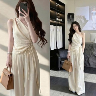 Áo kiểu dáng hở một bên vai quấn eo mix dây nơ dài phối quần suông rộng