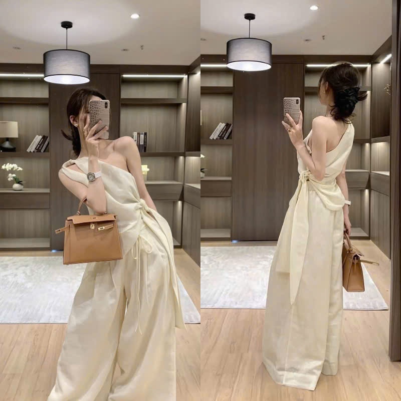 ZIMM STORE-Set áo lệch vai vắt chéo buộc nơ hông kèm quần dài ống suông màu beZIMM à thương hiệu thời trang thiết kế trẻ