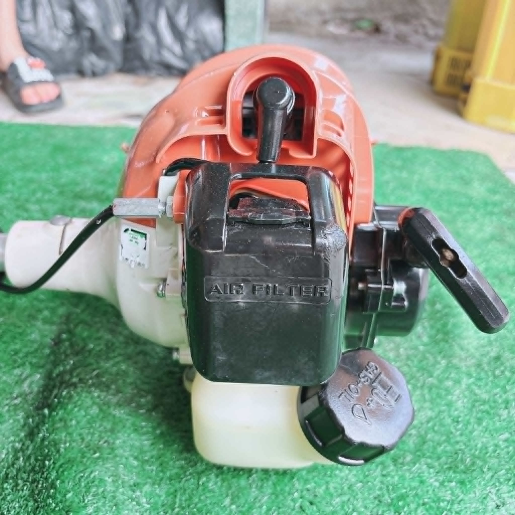 (25) Máy cắt cỏ MARUYAMA 26, bãi nhật, 2 thì, nòng 34 li, 26cc, trợ lực lớn, bền lợi xăng, nhẹ 4,5kg