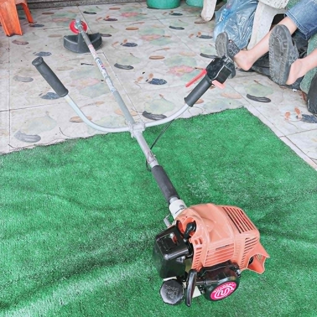 (25) Máy cắt cỏ MARUYAMA 26, bãi nhật, 2 thì, nòng 34 li, 26cc, trợ lực lớn, bền lợi xăng, nhẹ 4,5kg