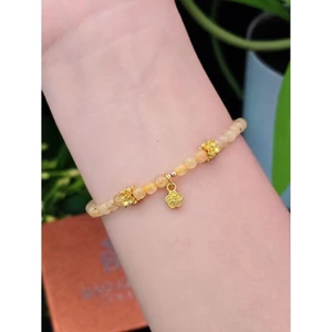 Lắc tay thạch anh tóc vàng mix charm hoa màu vàng