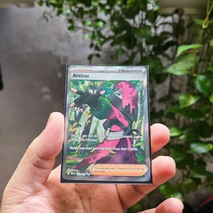 Thẻ Trainer Atticus 133/131 Ultra Rare