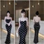 Đầm 2 dây đen chấm bi dáng dài khoét sau ở lưng cột nơ có mút,chất thun Ladong