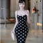 Đầm 2 dây đen chấm bi dáng dài khoét sau ở lưng cột nơ có mút,chất thun Ladong