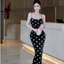 Đầm 2 dây đen chấm bi dáng dài khoét sau ở lưng cột nơ có mút,chất thun Ladong