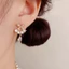 V.I.T Accessories | Bông tai nơ đính đá (2 màu)