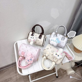 Túi xách nữ mini ,cầm tay họa tiết mèo đáng yêu size 17cm dáng trống kèm charm bông cute - TXN086