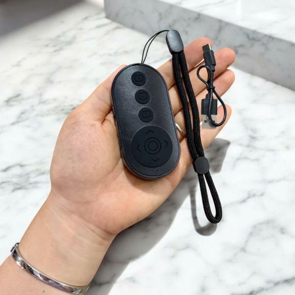 Remote M9 điều kiển bluetooth chụp ảnh  ,dùng được nhiều app khác.