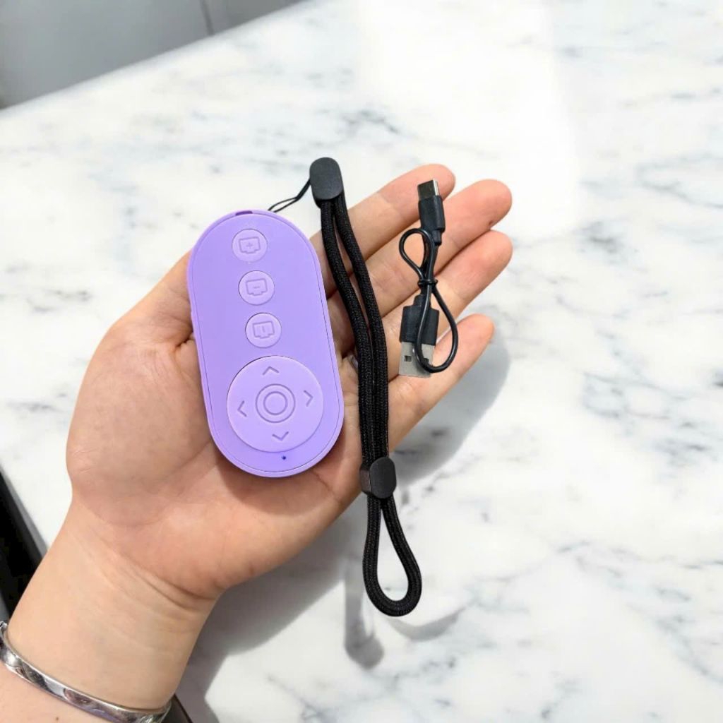 Remote M9 điều kiển bluetooth chụp ảnh  ,dùng được nhiều app khác.