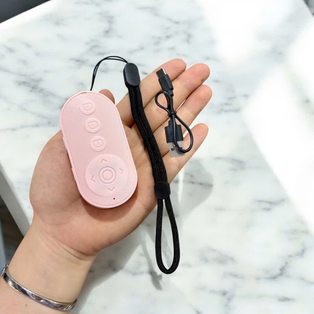 Remote M9 điều kiển bluetooth chụp ảnh  ,dùng được nhiều app khác.
