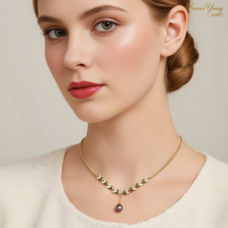 DC135 - Dây chuyền ngọc Trai 7-8 li, mặt bông lúa viền vàng, 1 hạt ngọc xanh tím, chiều dài 42-46cm, bạc mạ vàng 18K.