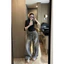 Quần jeans mài bạc đính đá dây đai