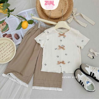 Bộ Đồ Bé Gái DORI Áo Thun Hoa Đính Nơ Quần Lửng Viền Ren – Bộ Bé Gái Dễ Thương Size 2–10 Tuổi