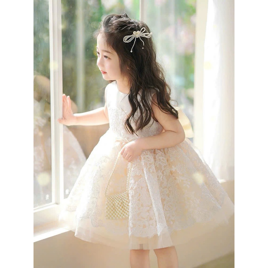 váy trắng kem bồng xoè nơ to sau lưng - váy cho bé Diệu linh shopkids sz 8-38kg DL78