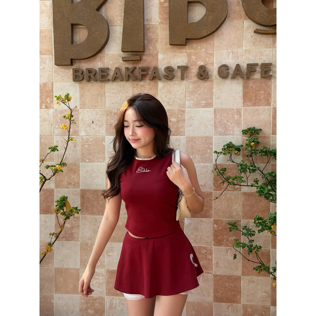 Set IRIDA SET Áo Balo Viền Ren Phối Chân Váy Cạp Trễ Thêu Nơ Đáng Yêu (BÁN LẺ) SECODEE