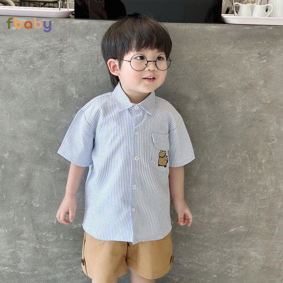 Chi tiết áo sơ mi kẻ bé trai