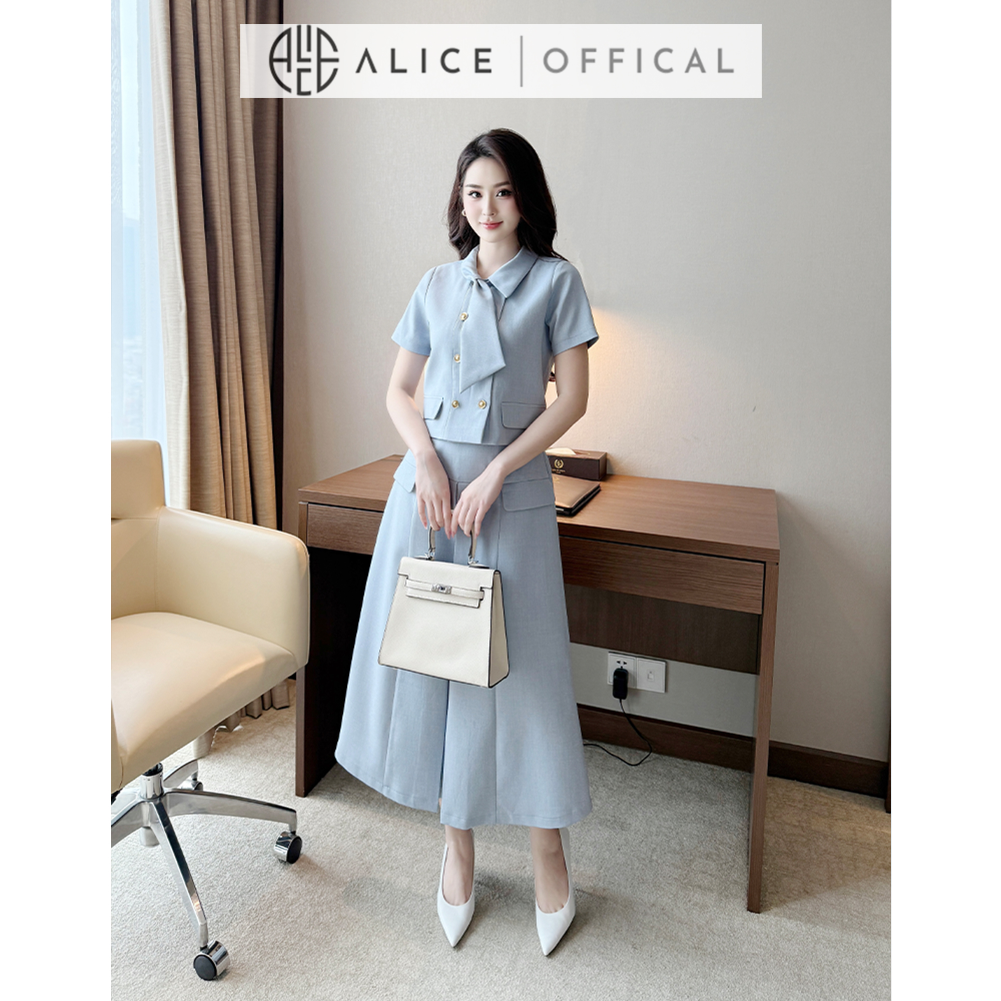 Mô tả Set Váy Công Sở Thanh Lịch Alice Chất Tuytsi, Áo Ngắn Tay Cổ Sơ Mi Phối Vạt Kèm Chân Váy Dài Xếp Ly S845 - 1