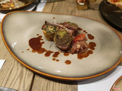 Mint crusted lamb chops served with chard pudding and pine nuts