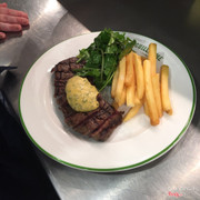 Medium rare sirloin steak with home made chips and bernaise sauce