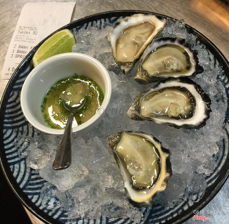 Oyster with bonzu dressing and chives