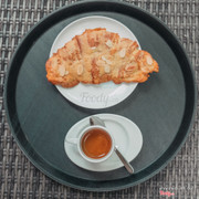 Almond croissant with espresso