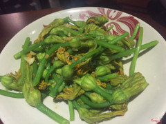 Pumpkin flower stir fry with garlic