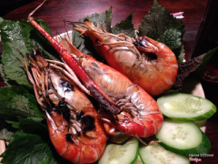 Grilled giant prawns with a tangy green dipping sauce (spicy!)